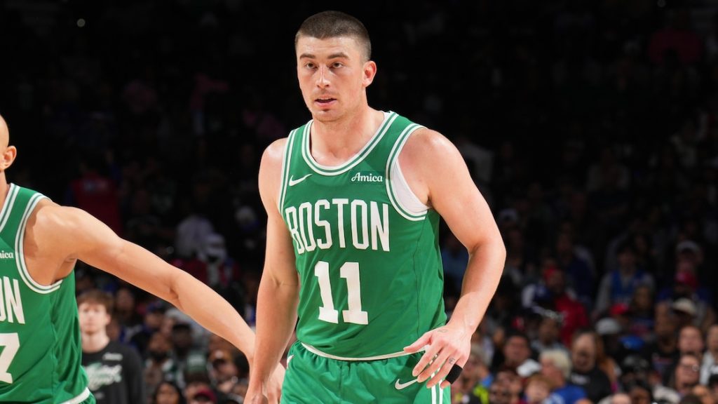 Payton Pritchard of the Boston Celtics dribbling the ball during a game.