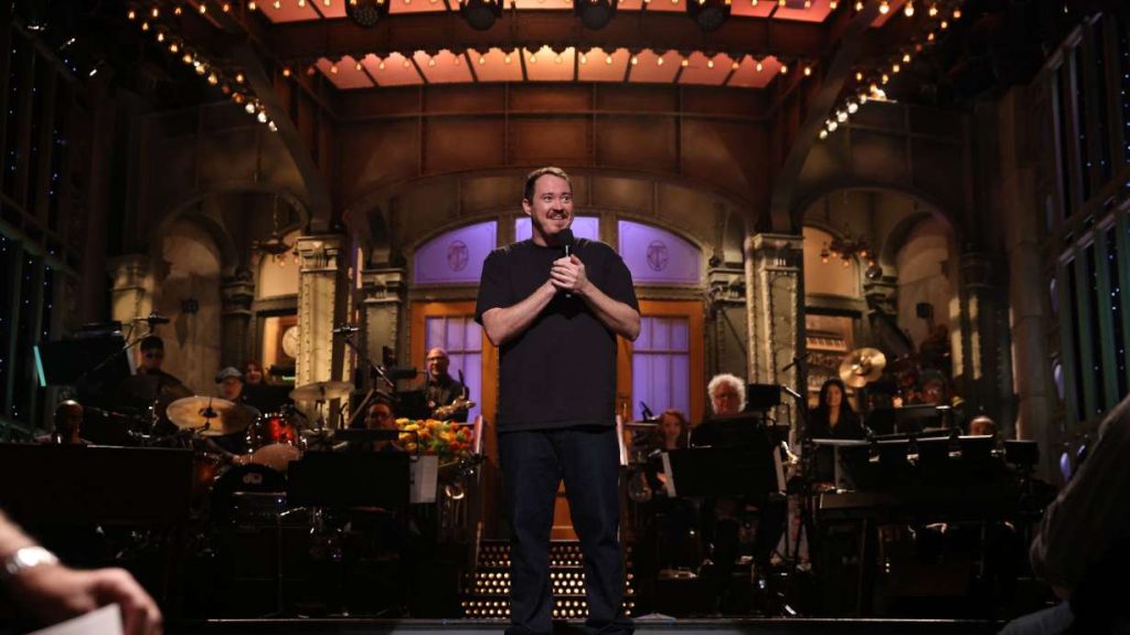 Shane Gillis performing on the Saturday Night Live stage.