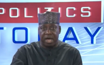 Microphones on a podium during a political press briefing in Nigeria.