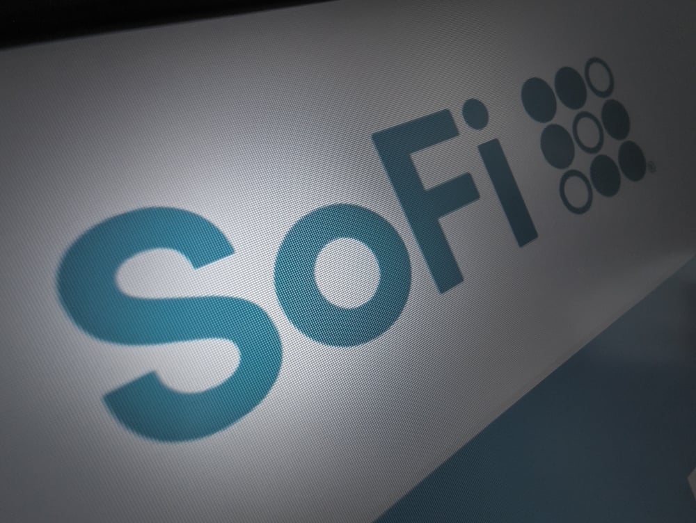 Digital stock market graph displaying red downward trend lines for SoFi stock