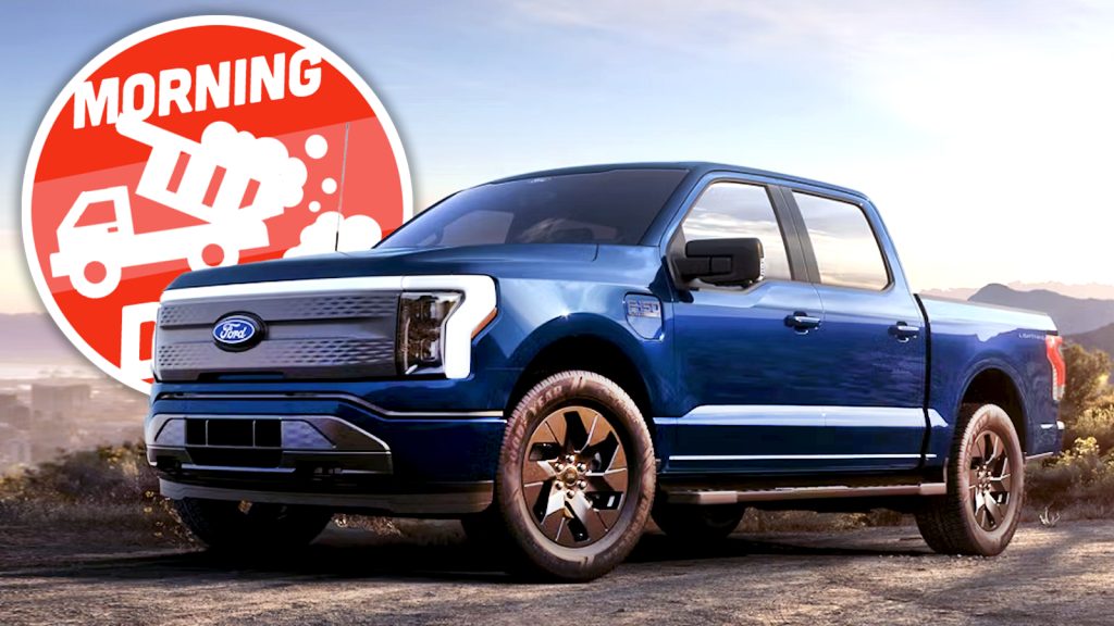 A Ford F-150 Lightning electric truck parked outside.