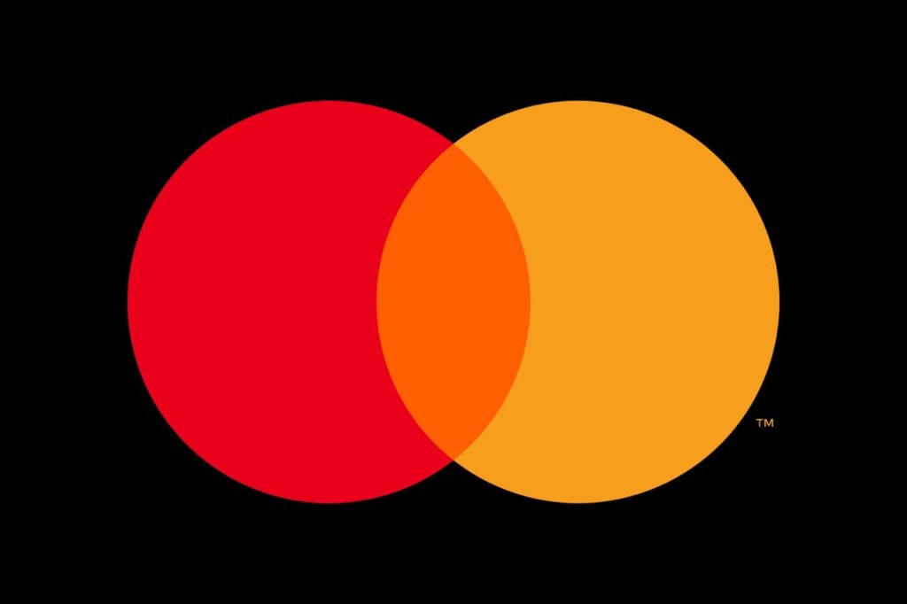 A Nigerian entrepreneur using digital payment technology in their business.