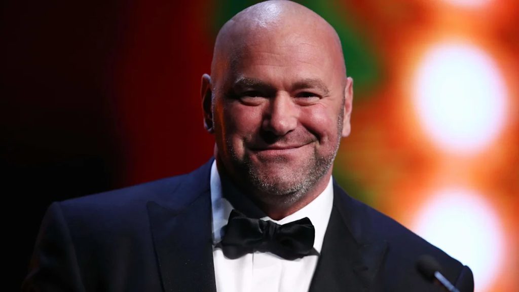 Dana White speaking at a press conference alongside images of Alex Pereira and Daniel Cormier.
